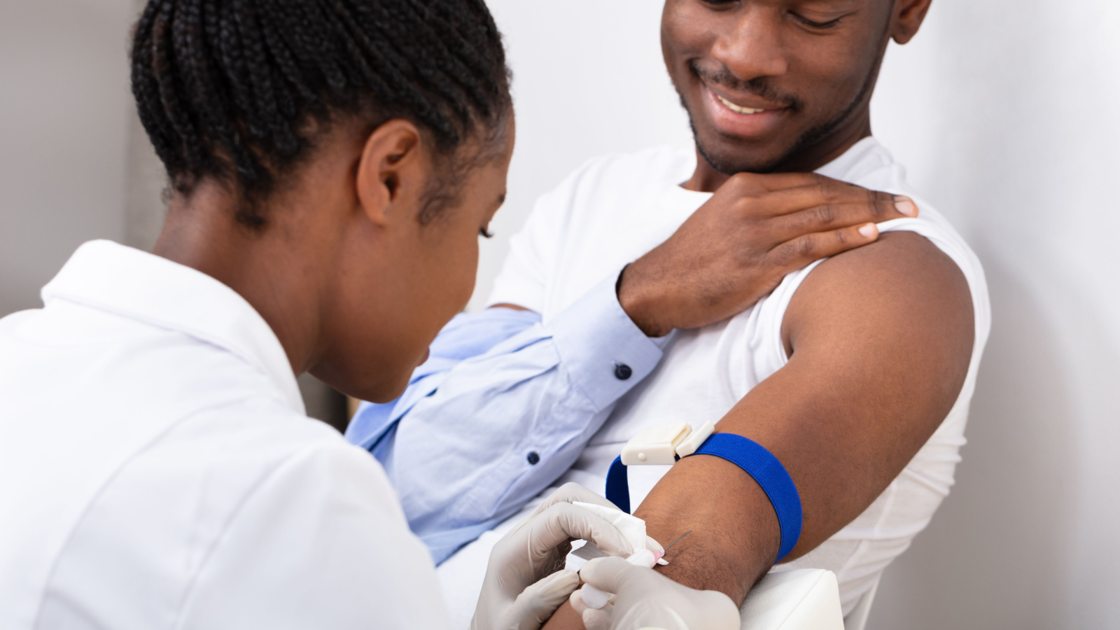 Close-up Of Female Doctor Collecting A Blood Sample