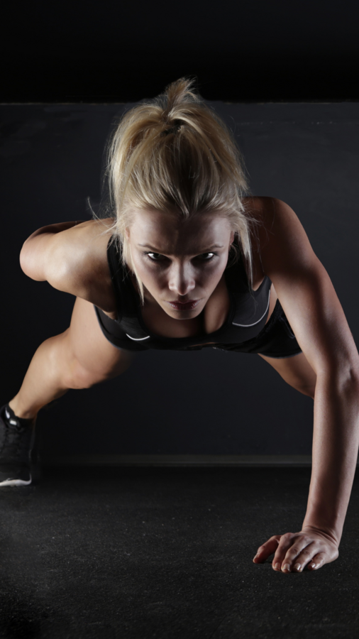 Woman doing one arm pushup