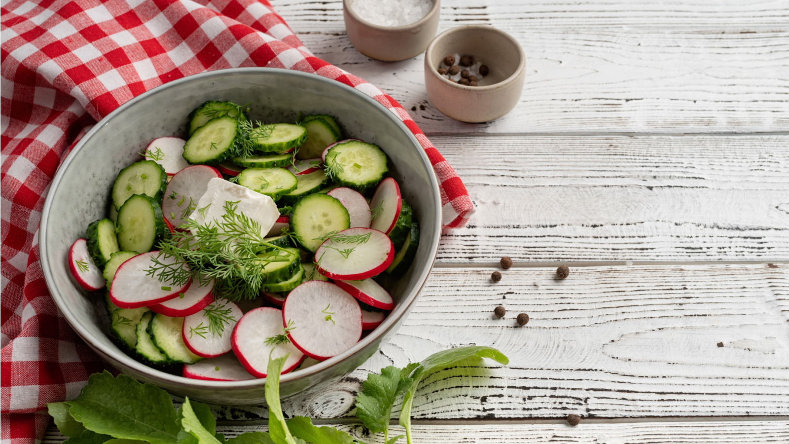 Bowl of healthy vegetarian salad with raddish cucumber and fennel