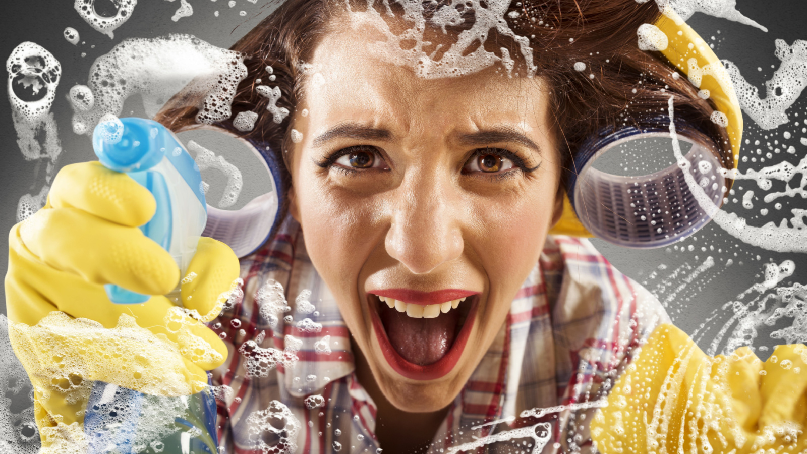 Screaming housewife while cleaning the glass