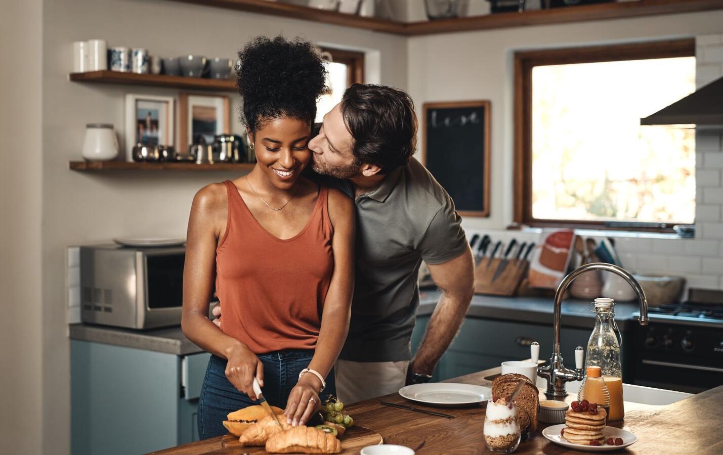 Couple kissing in the kitchen