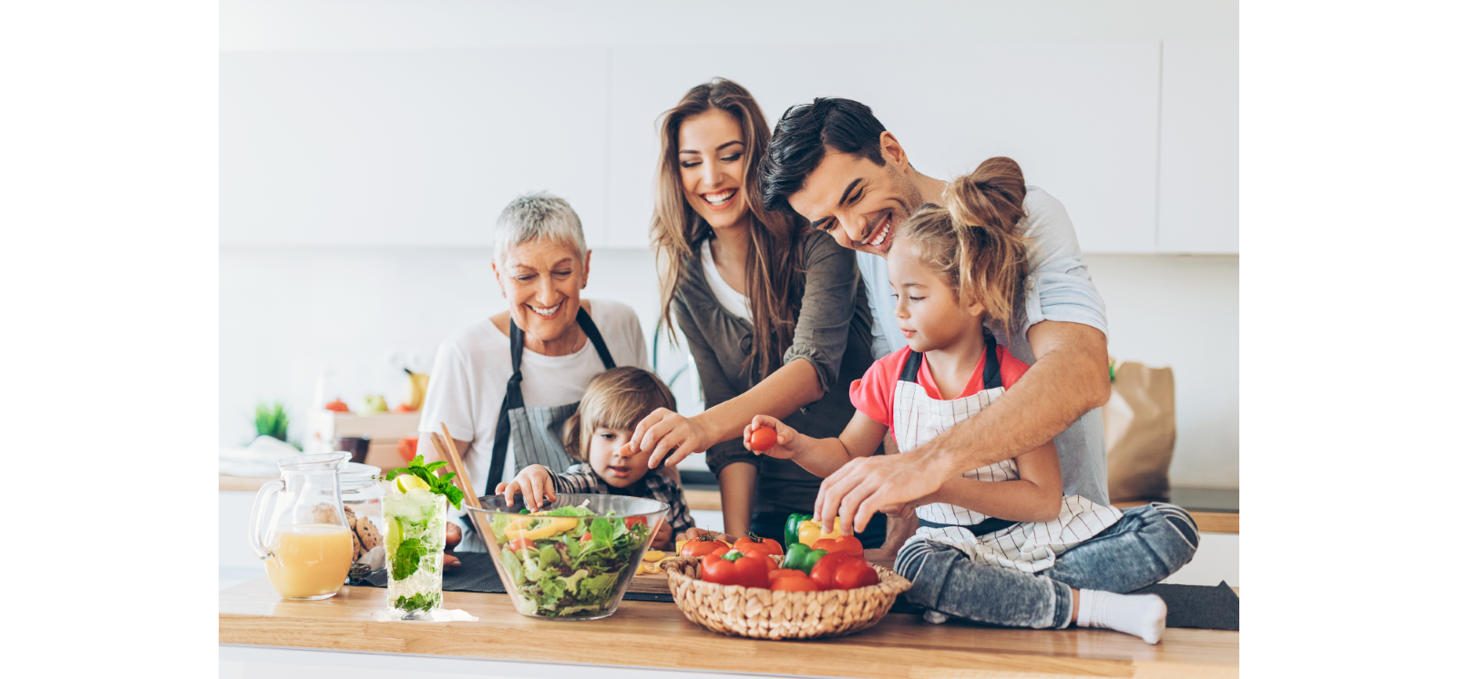 Family around food on the kitchen counter