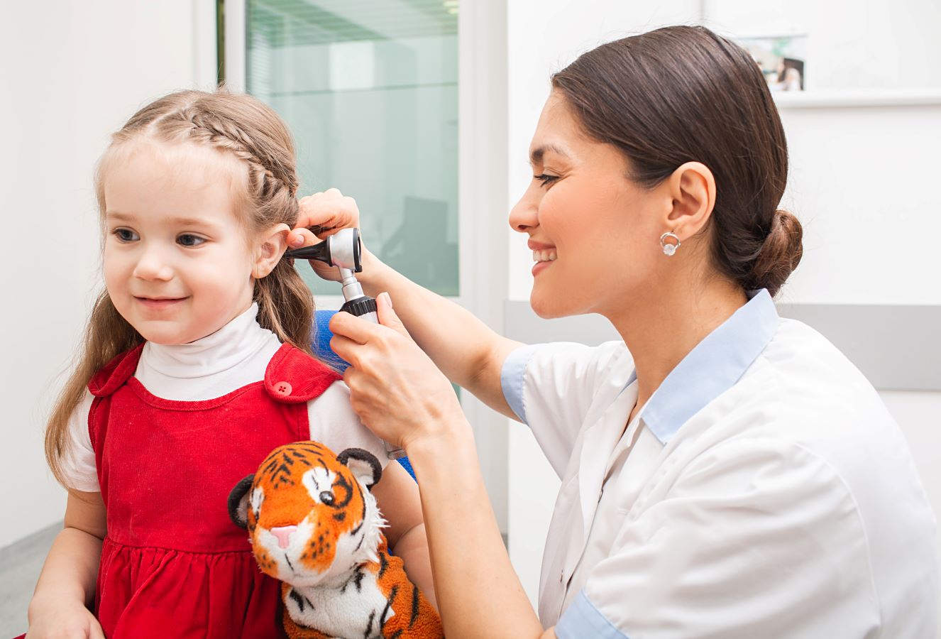 Doctor performing ear exam