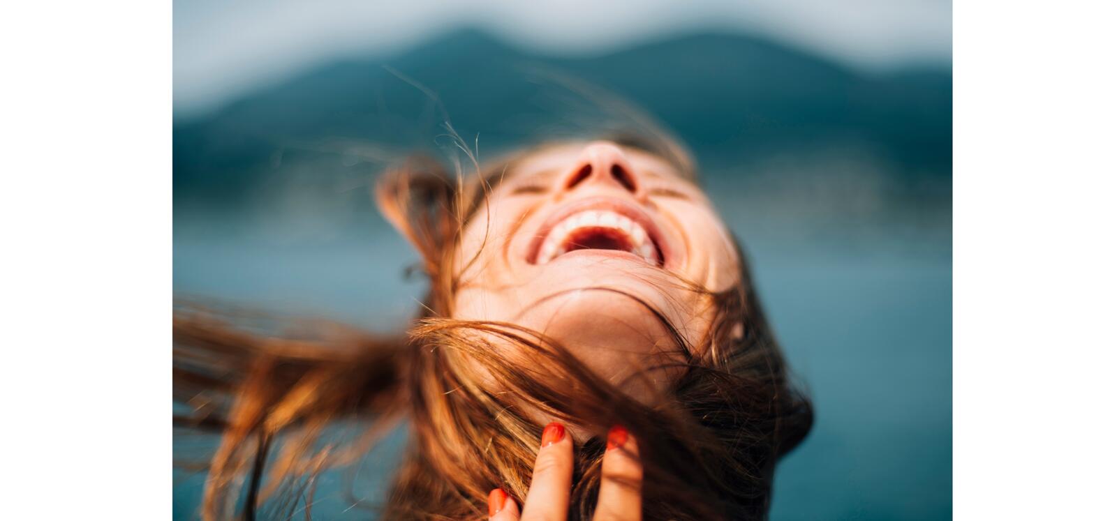Woman with head back expressing joy