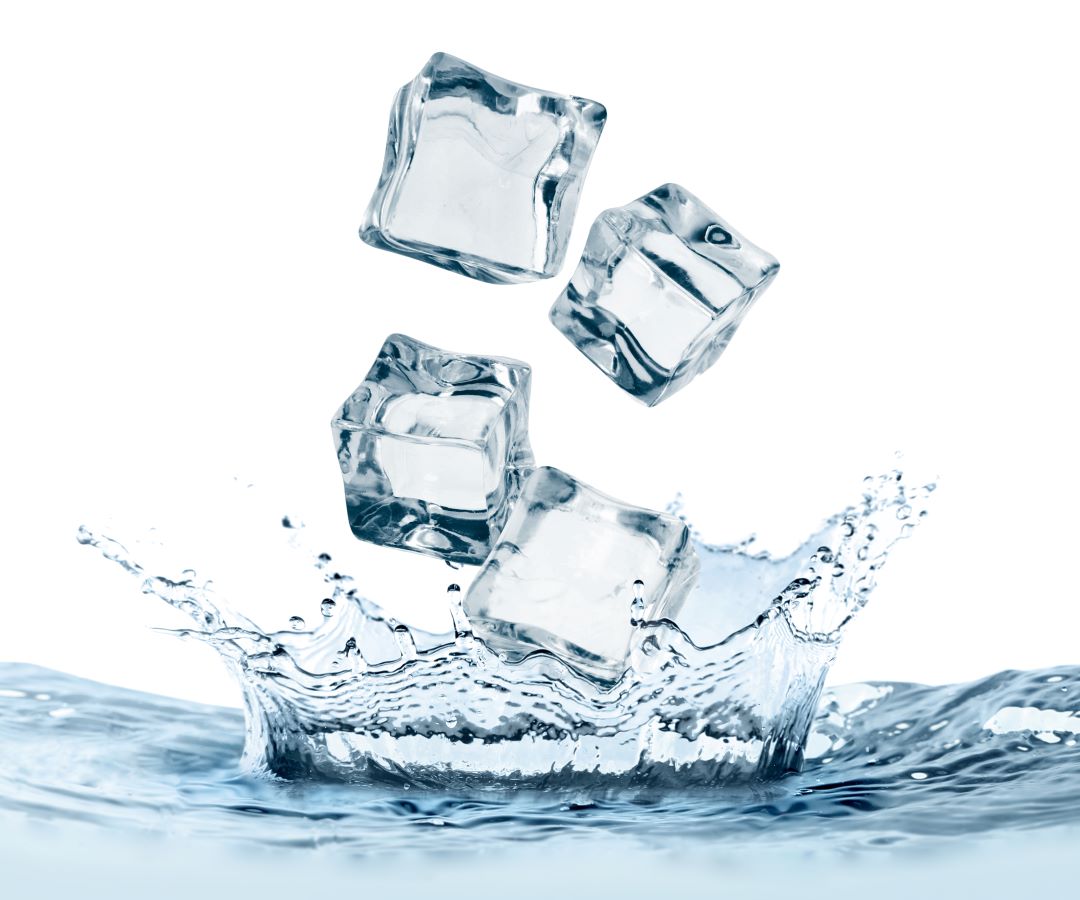 Ice cubes falling into water on white background