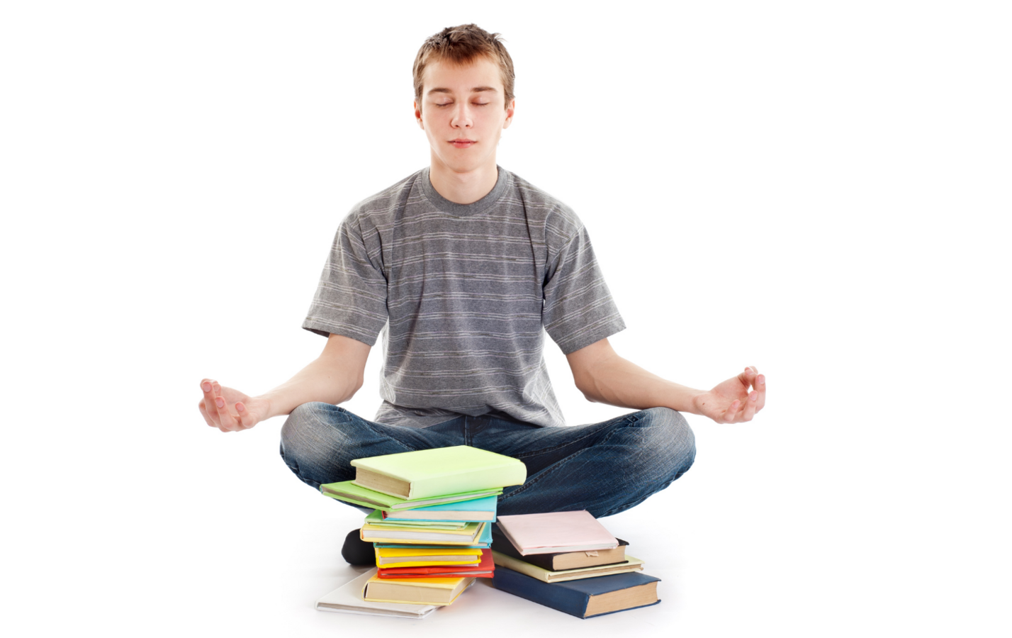 man meditating with books