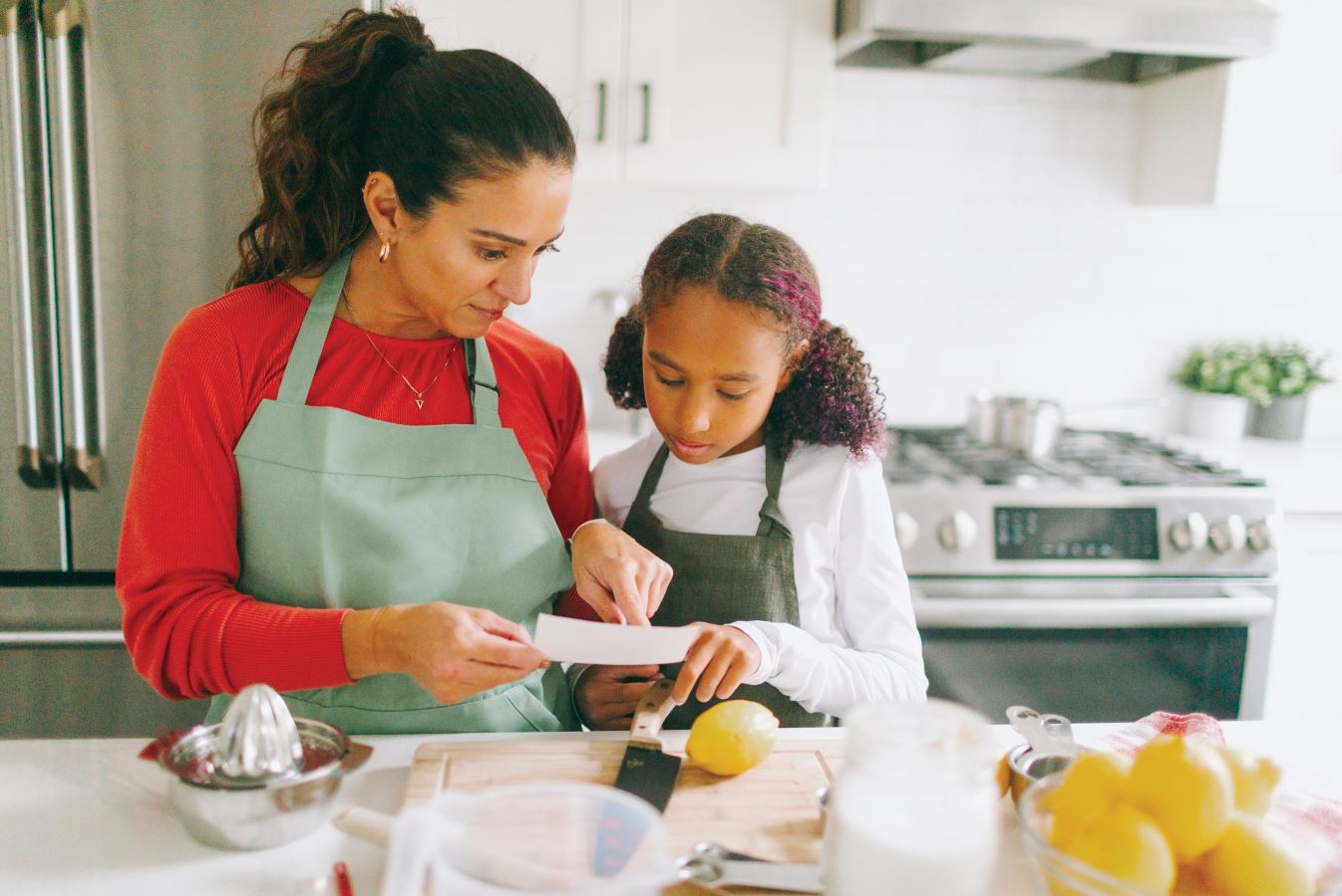 Mother and daughter cooking together