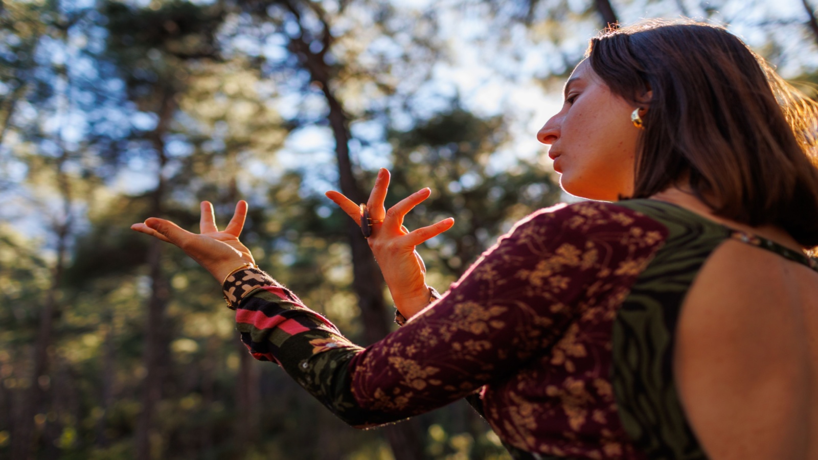 woman in forest dancing solo
