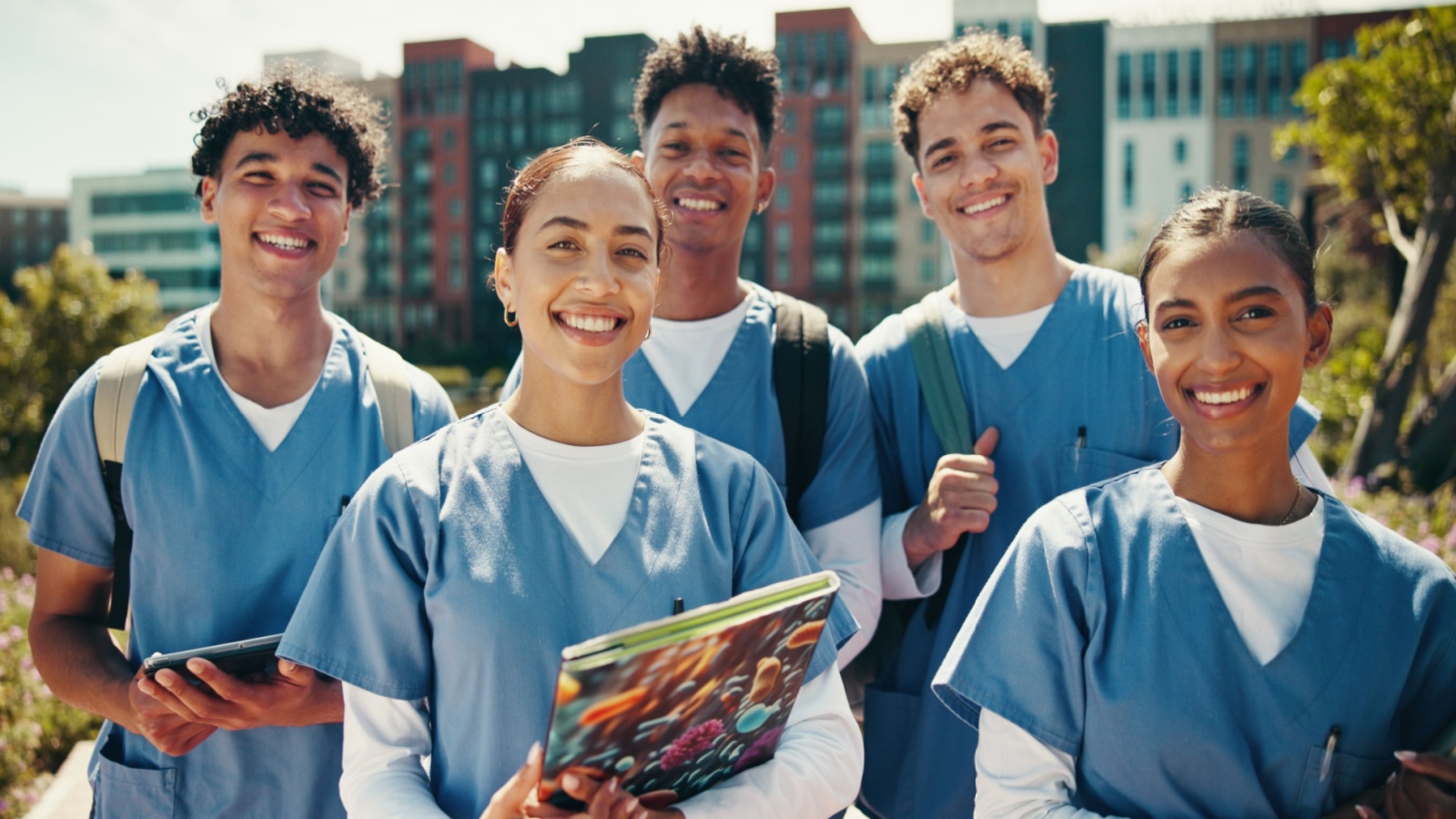 Group of young medical students smiling at camera