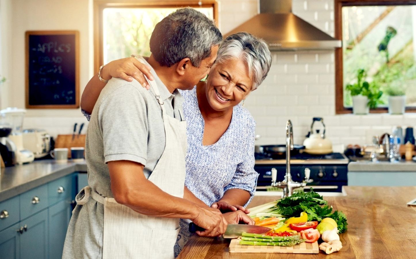 A couple cooking in the kitchen