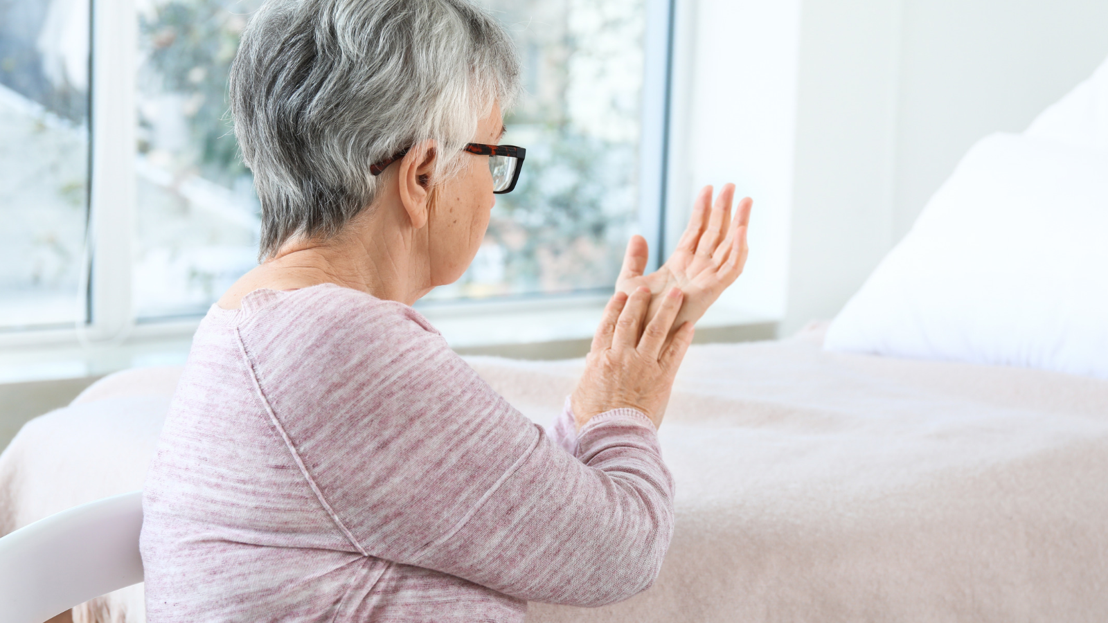 Senior woman struggling with Parkinson’s 