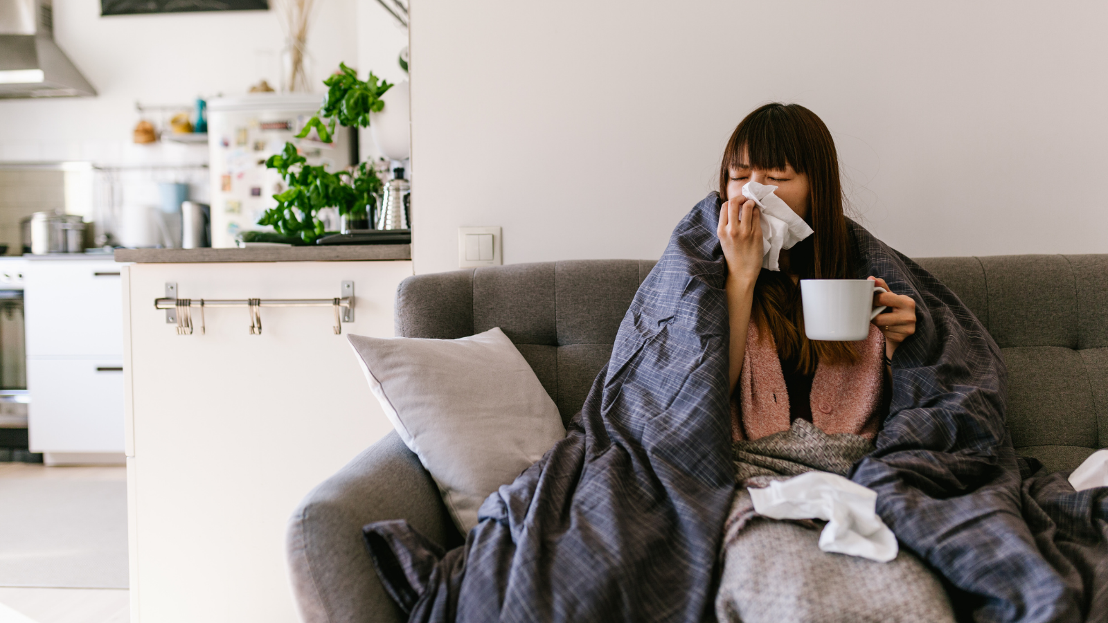 woman home sick with the common cold