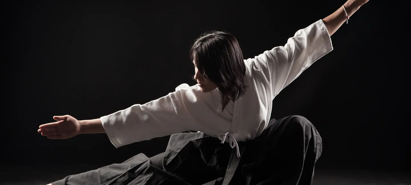 woman demonstrating Aikido technique