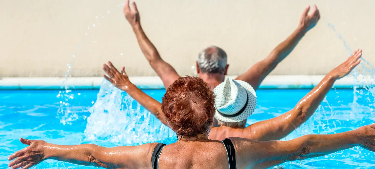 elderly people doing therapy in water