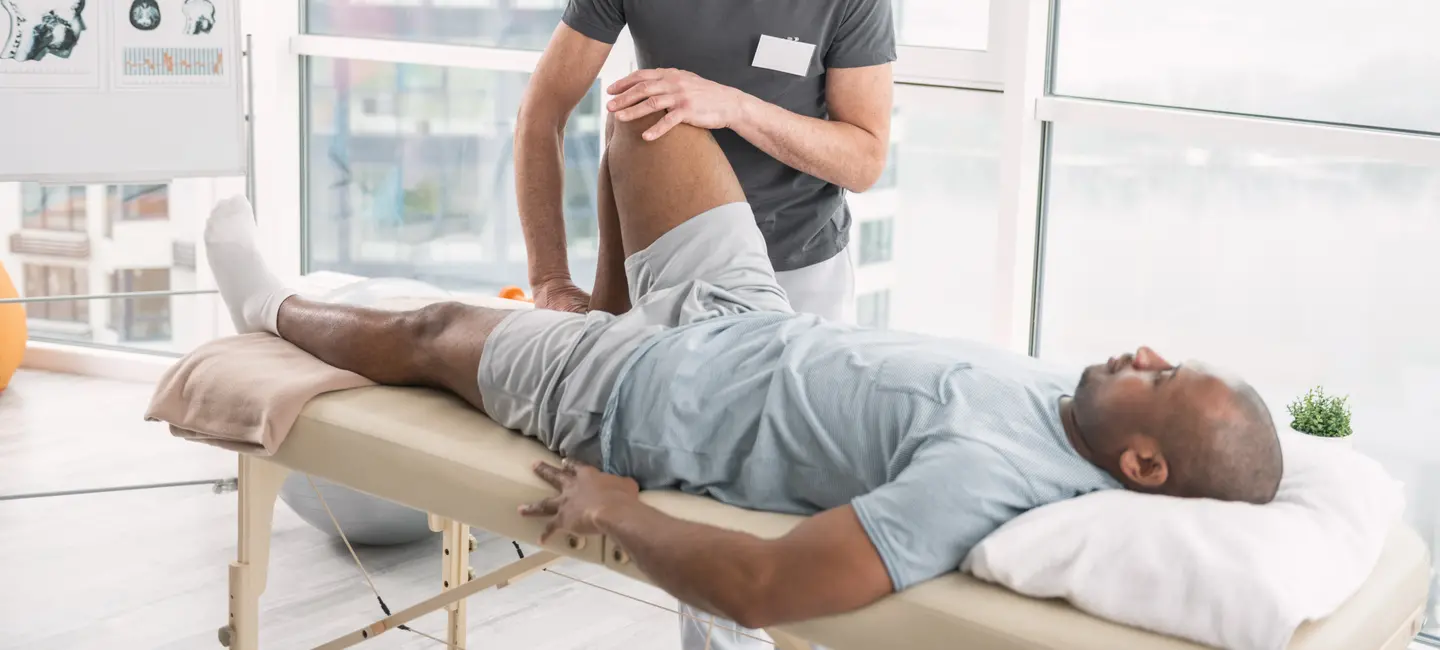 male  patient receiving Physical Therapy