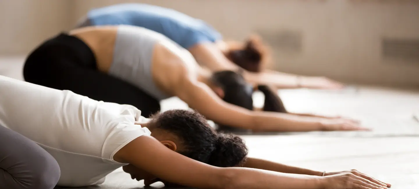 women demonstrating Yoga