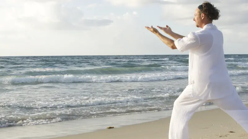 man tai chi on beach man tai chi on beach
