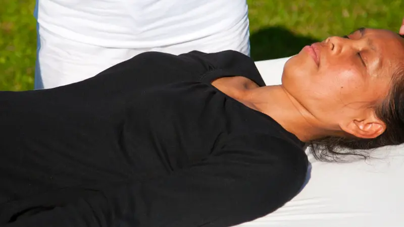 woman supine on massage table woman supine on massage table