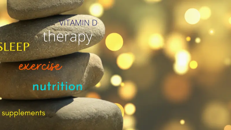 Stacked stones with wellness words imprinted Stacked stones with wellness words imprinted
