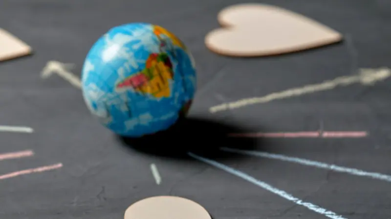 Globe and figures of hearts Globe and figures of hearts
