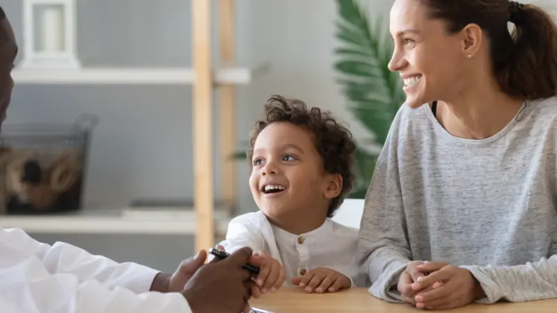 mom and little preschooler son visiting family doctor