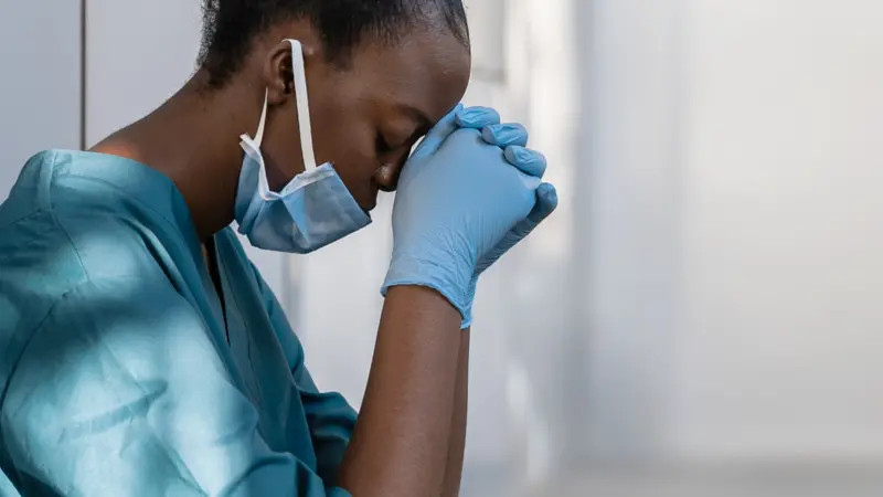 Exhausted sad doctor feels burnout stress of corona virus frontline Exhausted sad doctor feels burnout stress of corona virus frontline