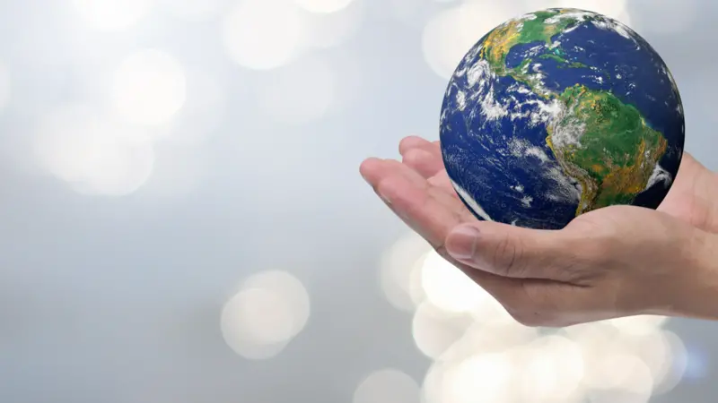 man hand gesture palm up holding world on blurred peaceful water surface background man hand gesture palm up holding world on blurred peaceful water surface background