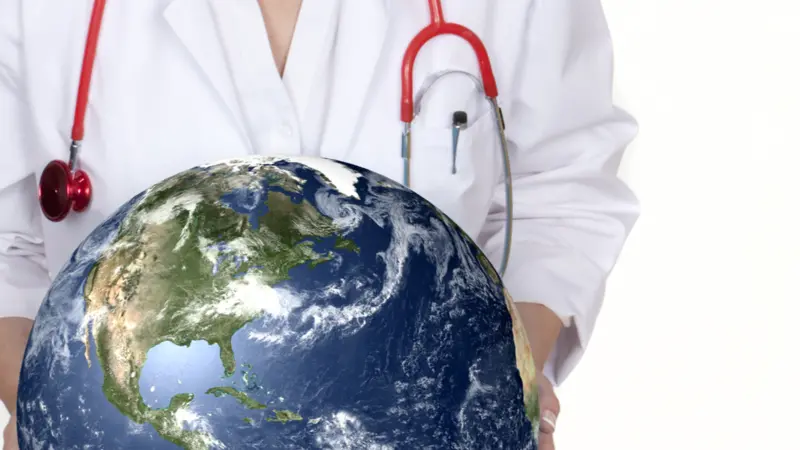 Physician holding plant earth in her hands. 
