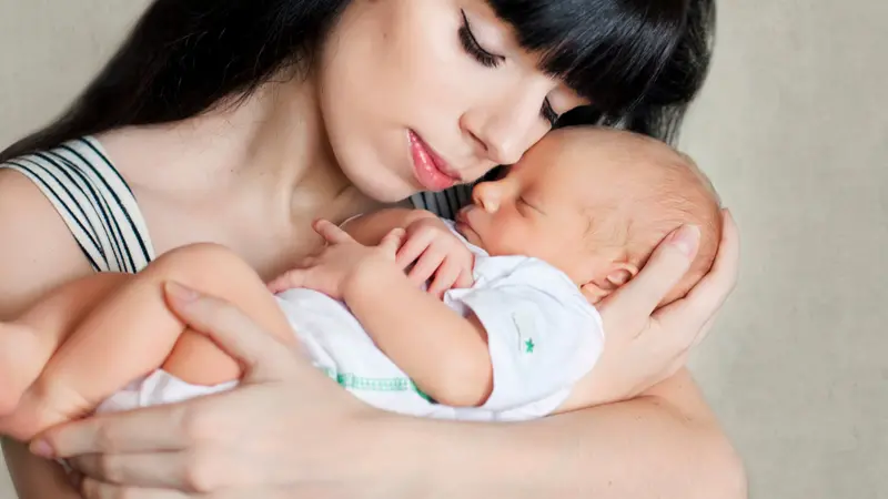 mother holding her newborn baby