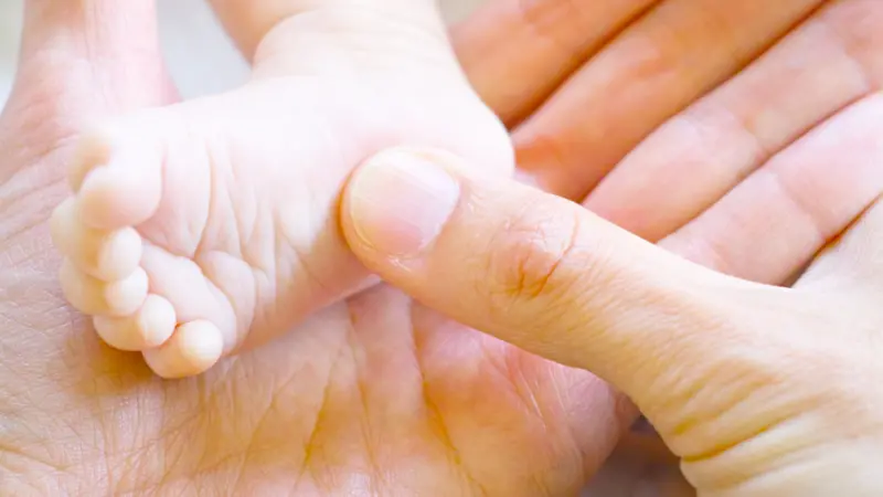 Newborn baby foot sole massage