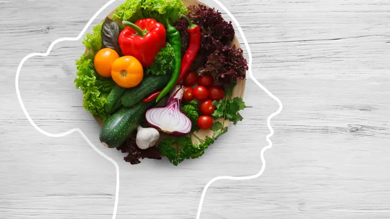 Fresh vegetables in woman head symbolizing health Fresh vegetables in woman head symbolizing health