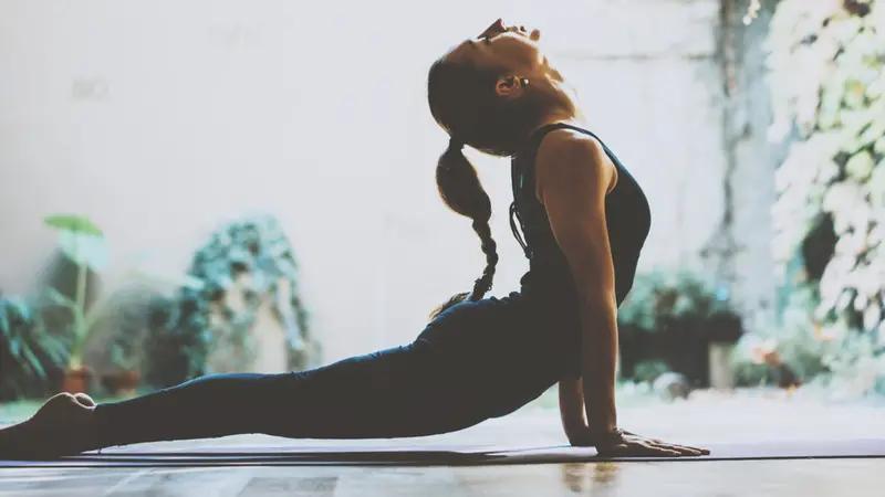 woman practicing yoga indoor
