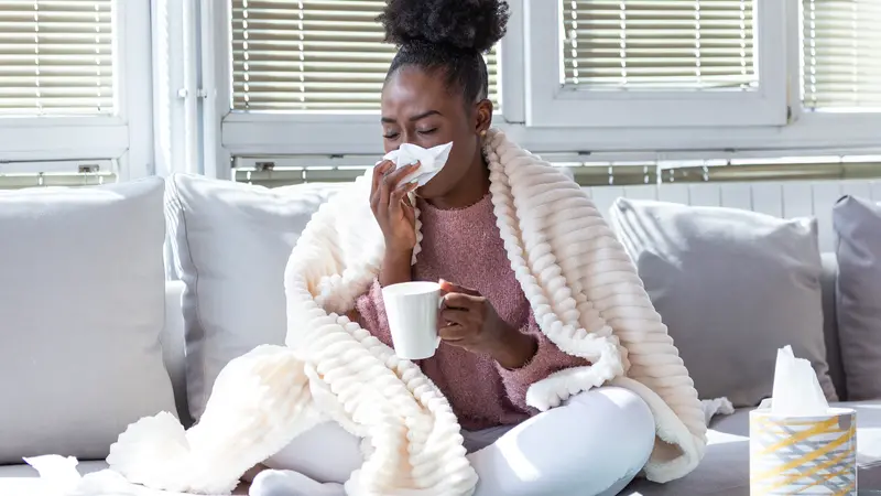 woman has runny nose and common cold woman has runny nose and common cold
