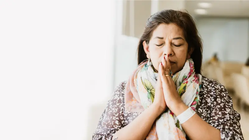 woman praying in the morning in hospital