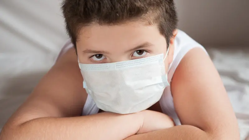 overweight boy wearing covid-19 mask overweight boy wearing covid-19 mask