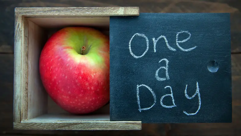 Apple in a natural wooden box. One a day keeps the Doctor away