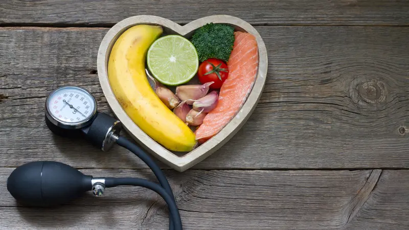 Health heart diet food concept with blood pressure gauge Health heart diet food concept with blood pressure gauge