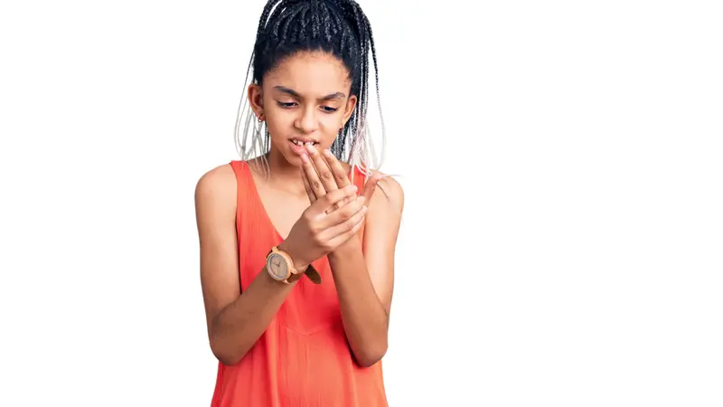 girl wearing casual clothes suffering pain on hands and fingers, arthritis inflammation girl wearing casual clothes suffering pain on hands and fingers, arthritis inflammation