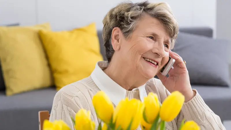 senior woman talking on the phone senior woman talking on the phone