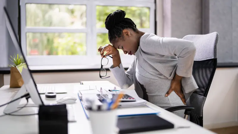 Woman Sitting In Office Woman Sitting In Office