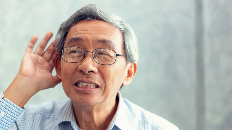 Close-Up of Elderly Male Has Hearing Problem Cupping His Ear