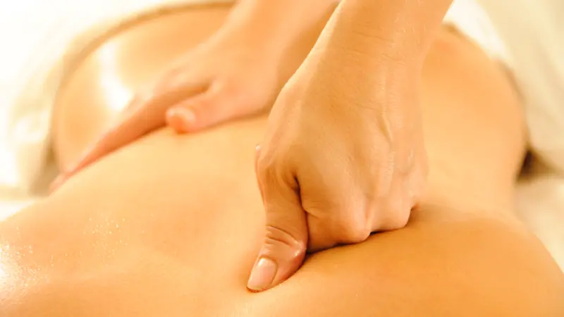 Beautiful woman in a spa with massage therapy