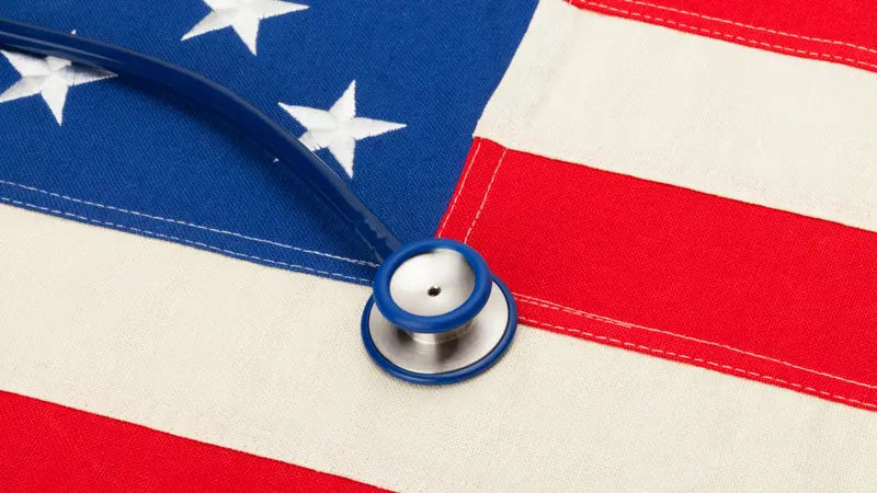 USA flag with stethoscope over it