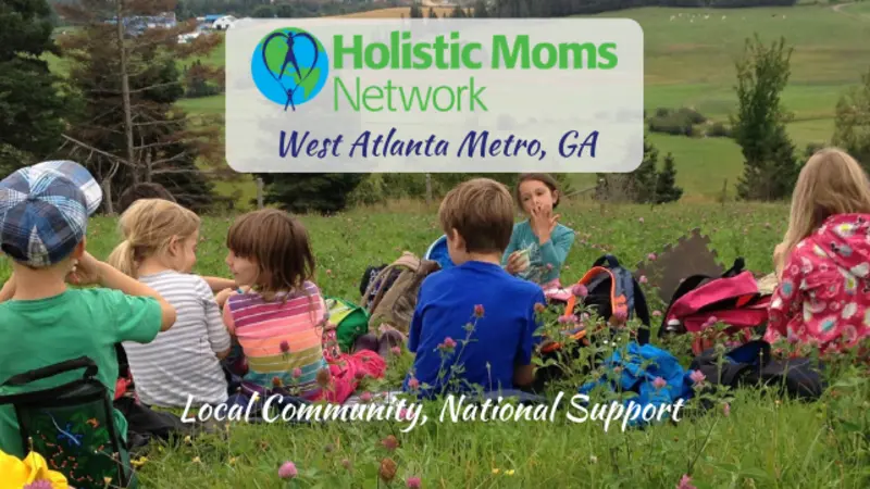 children having a snack in a field, holistic moms network logo top center with West Atlanta, GA chapter, bottom center reads Local Community, National Support