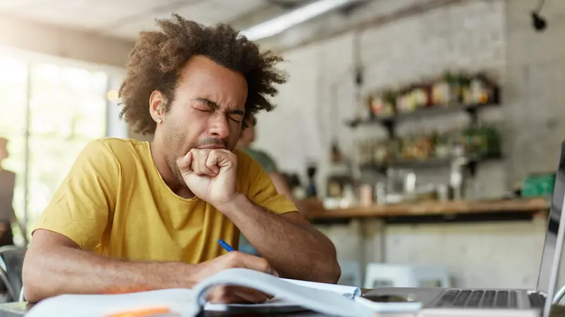 Exhausted sleepy black European man yawning Exhausted sleepy black European man yawning