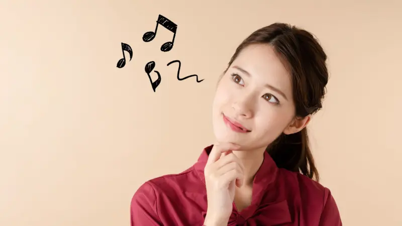 Cheerful Asian girl humming. Cheerful Asian girl humming.