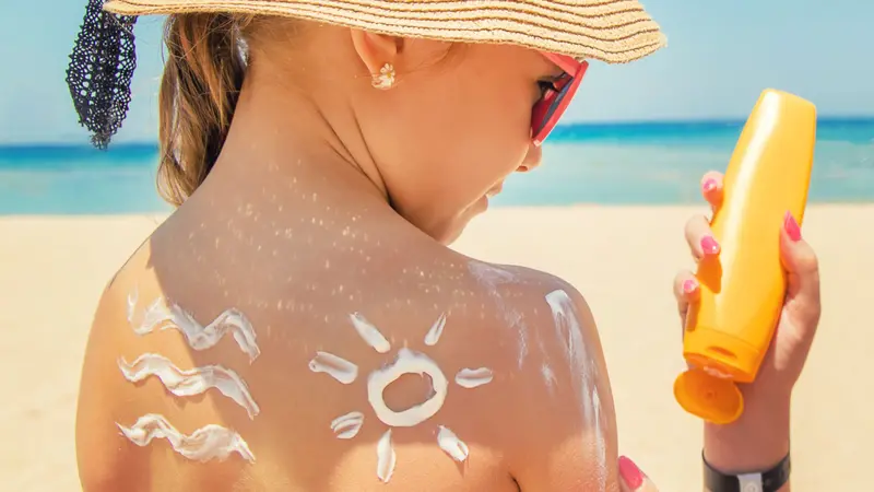 Sunscreen on the skin of a child. Sunscreen on the skin of a child.