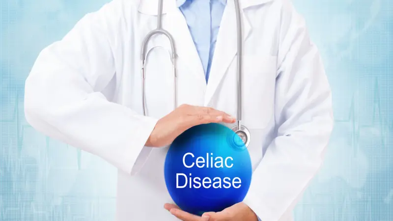 Doctor holding blue crystal ball with celiac disease sign on medical background. Doctor holding blue crystal ball with celiac disease sign on medical background.