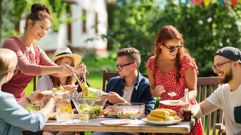 sharing salad at summer garden part