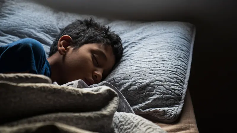 A Hispanic Young Boy Sleeping 